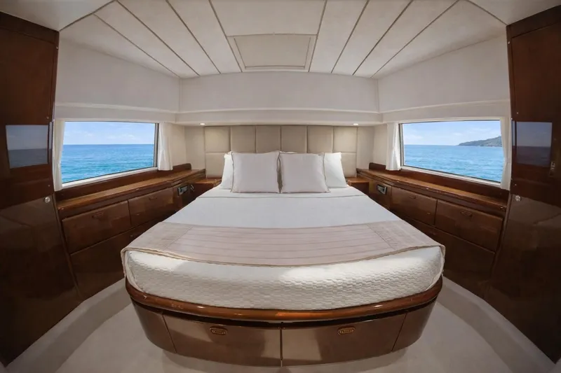 Hasard Yacht Photos Pics Luxurious bedroom interior of 2002 Ferretti Yachts 720 with ocean view.