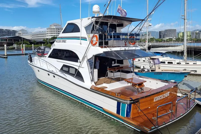 Megisti Spirit Yacht Photos Pics 2008 Westcoaster 70 Flybridge Cruiser docked at marina, featuring spacious deck and modern design.