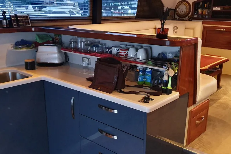 Megisti Spirit Yacht Photos Pics Interior of 2008 Westcoaster 70 Flybridge Cruiser with kitchen and dining area.