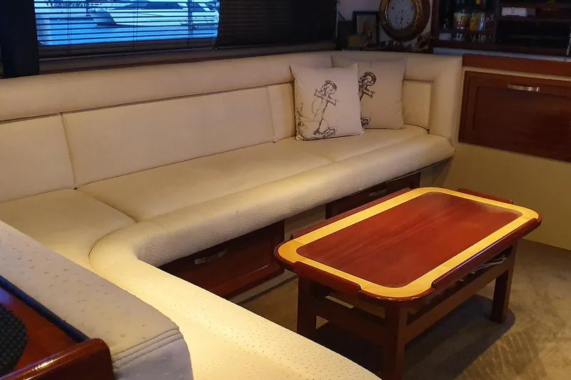 Megisti Spirit Yacht Photos Pics Luxurious interior of 2008 Westcoaster 70 Flybridge Cruiser with plush seating and elegant table.
