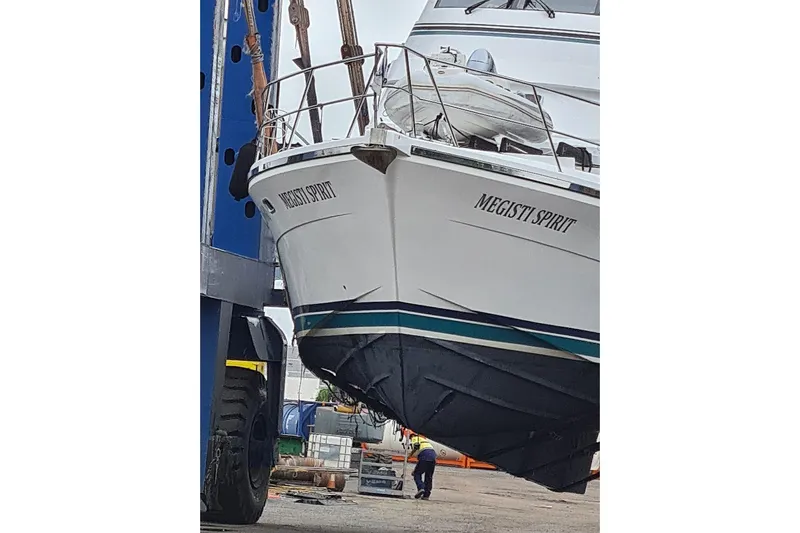 Megisti Spirit Yacht Photos Pics 2008 Westcoaster 70 Flybridge Cruiser "Megisti Spirit" being lifted by crane at dock.