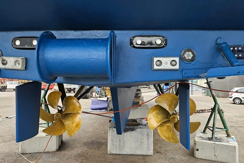 Megisti Spirit Yacht Photos Pics 2008 Westcoaster 70 Flybridge Cruiser with dual propellers and blue hull in dry dock.