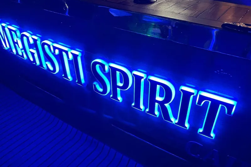 Megisti Spirit Yacht Photos Pics Blue neon-lit sign on Westcoaster 70 Flybridge Cruiser, 2008 model.