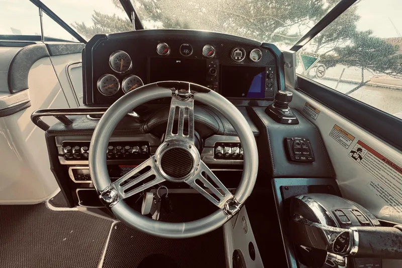  Yacht Photos Pics 2019 Formula 310 FX Bowrider helm with modern controls and sleek steering wheel.