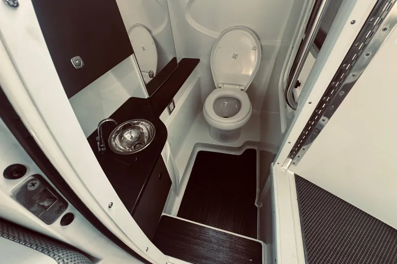  Yacht Photos Pics 2019 Formula 310 FX Bowrider bathroom with sink and toilet, modern design.