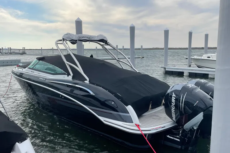  Yacht Photos Pics 2019 Formula 310 FX Bowrider docked with Mercury outboard engines, covered and ready for adventure.