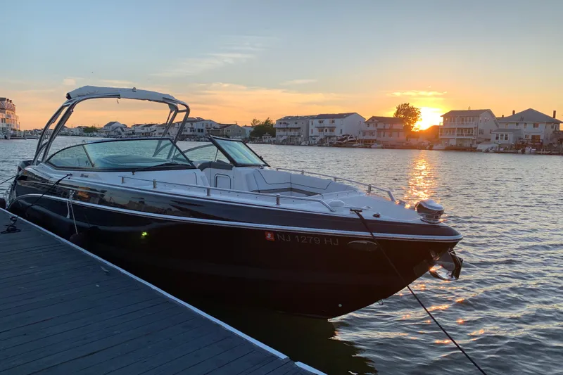  Yacht Photos Pics 2019 Formula 310 FX Bowrider docked at sunset, serene waterfront view.
