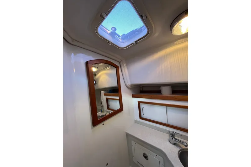 Galene Yacht Photos Pics 2010 Back Cove 33 Express Hardtop bathroom with skylight, mirror, and sink.