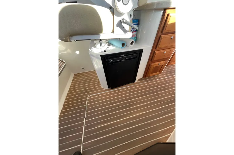Galene Yacht Photos Pics 2010 Back Cove 33 Express Hardtop interior with wood flooring and compact kitchen amenities.