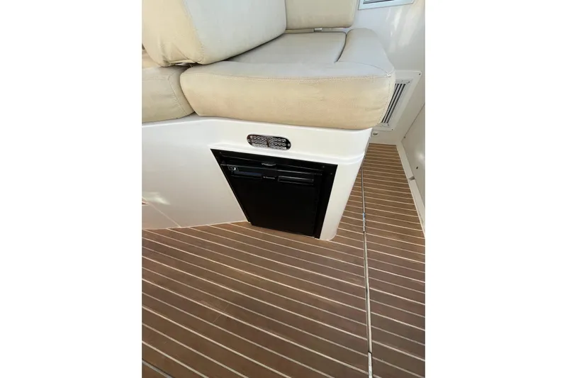 Galene Yacht Photos Pics 2010 Back Cove 33 Express Hardtop interior with cushioned seating and wooden flooring.