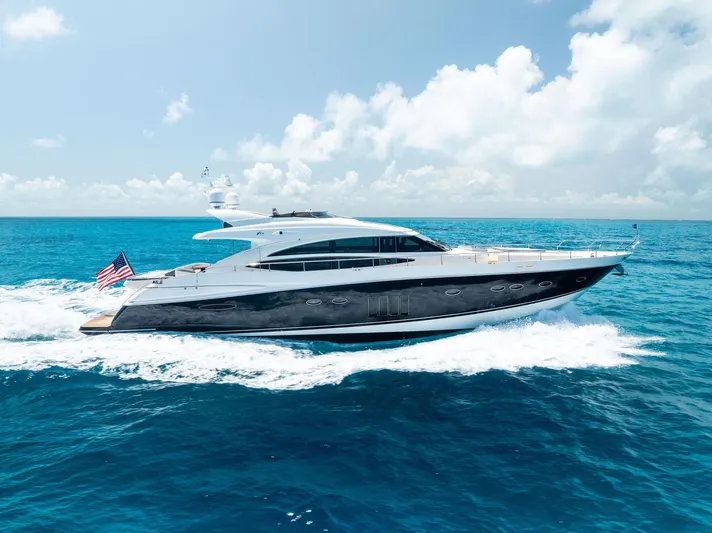 Mojo II Yacht Photos Pics 2009 Princess Motor Yacht cruising on open sea under clear blue sky.