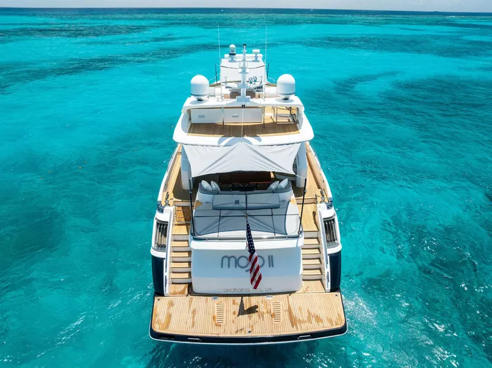 Mojo II Yacht Photos Pics Luxury 2009 Princess Motor Yacht on clear turquoise waters.