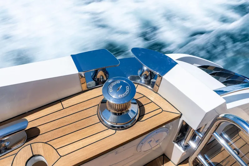 Mojo II Yacht Photos Pics 2009 Princess Motor Yacht deck with polished chrome details and teak wood finish.