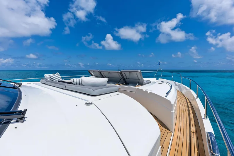 Mojo II Yacht Photos Pics Luxurious 2009 Princess Motor Yacht deck with sun loungers, ocean view, and clear blue sky.