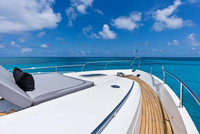 Mojo II Yacht Photos Pics Luxurious 2009 Princess Motor Yacht deck with ocean view and clear blue skies.