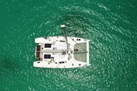 Aerial view of 2015 Flash Cat 52S catamaran on turquoise water.