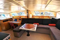 Interior of 2015 Flash Cat 52S yacht with modern seating and navigation area.