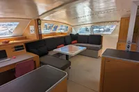 Interior of 2015 Flash Cat 52S yacht with modern seating and large windows.