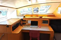 Interior of 2015 Flash Cat 52S yacht with navigation desk and laptop.