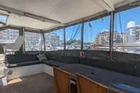 Spacious interior of 2015 Flash Cat 52S yacht with seating and dining area.