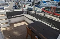 Spacious deck of 2015 Flash Cat 52S yacht with seating and table.