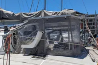 Sailing yacht Flash Cat 52S, 2015 model, docked with covered cockpit area.