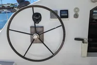Steering wheel of 2015 Flash Cat 52S yacht with navigation instruments.