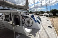 Sailing yacht Flash Cat 52S, 2015 model, docked with visible helm and deck area.
