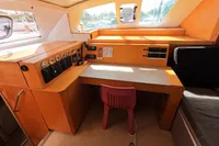 Interior of 2015 Flash Cat 52S yacht with navigation desk and control panel.