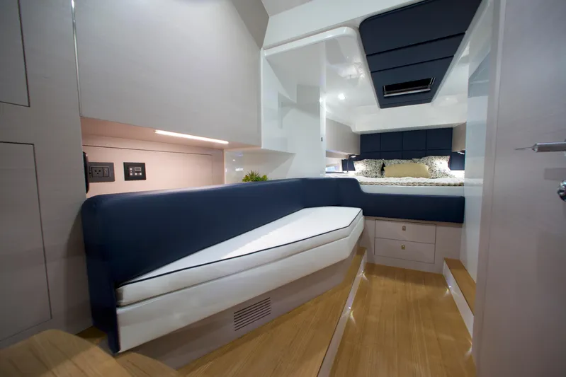  Yacht Photos Pics Luxurious interior of 2022 SACS 47 Rebel yacht with modern seating and wood flooring.