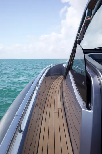  Yacht Photos Pics SACS 47 Rebel 2022 yacht on open sea with wooden deck and sleek design.