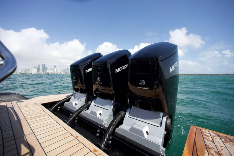  Yacht Photos Pics 2022 SACS 47 Rebel with triple Mercury outboard engines on open water.