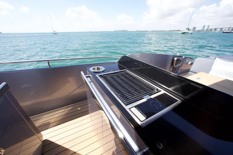  Yacht Photos Pics Luxury SACS 47 Rebel yacht deck with grill, 2022 model, overlooking serene ocean view.