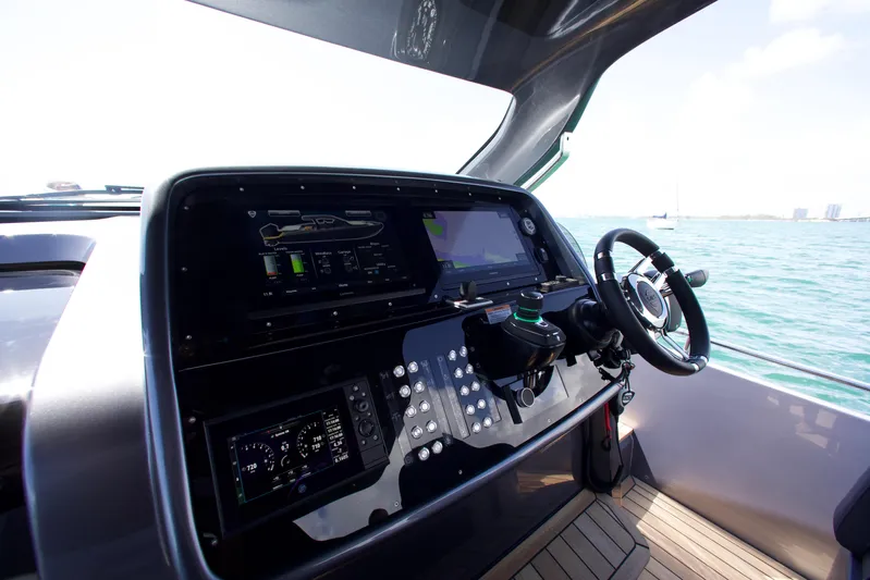  Yacht Photos Pics Cockpit of 2022 SACS 47 Rebel yacht with modern navigation controls.