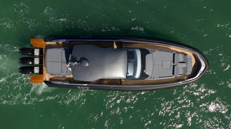  Yacht Photos Pics Aerial view of 2022 SACS 47 Rebel luxury boat on water.