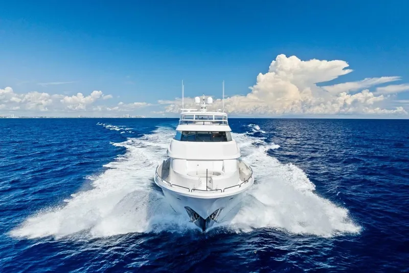 Yes Yacht Photos Pics Luxurious 2011 Westport yacht cruising on open ocean under clear blue sky.