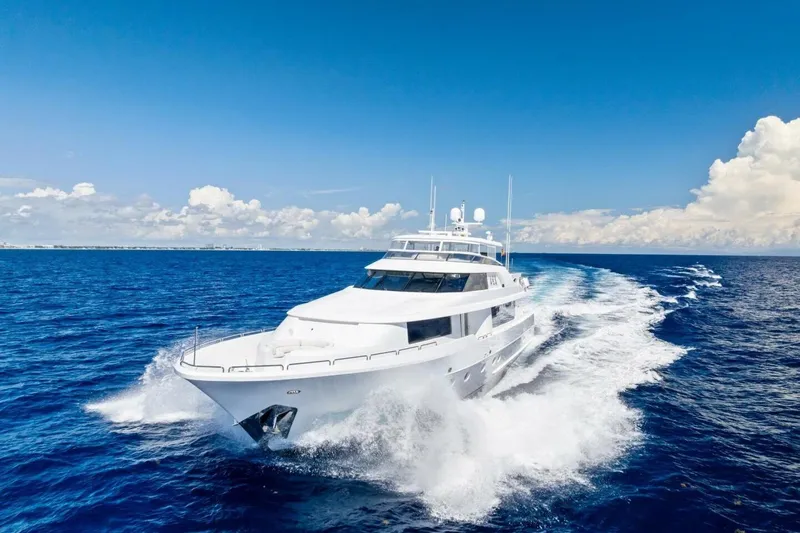 Yes Yacht Photos Pics Luxurious 2011 Westport yacht cruising on open ocean under clear blue sky.