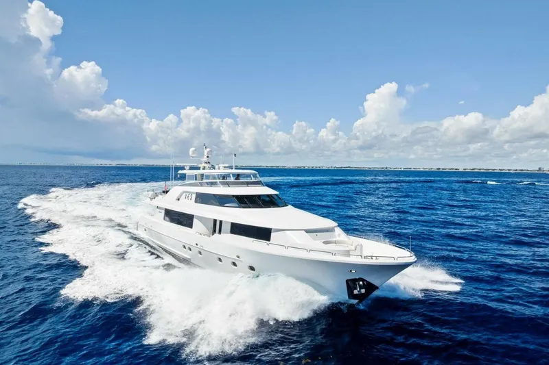 Yes Yacht Photos Pics Luxurious 2011 Westport yacht cruising on open ocean under clear blue sky.