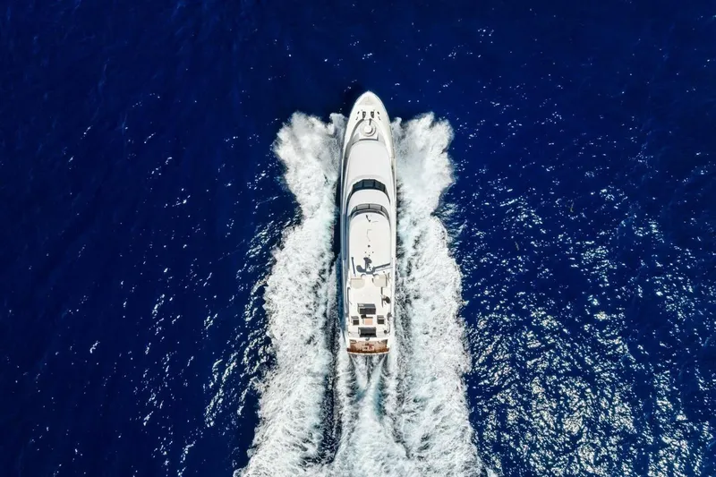 Yes Yacht Photos Pics Aerial view of 2011 Westport yacht cruising through deep blue ocean waters.