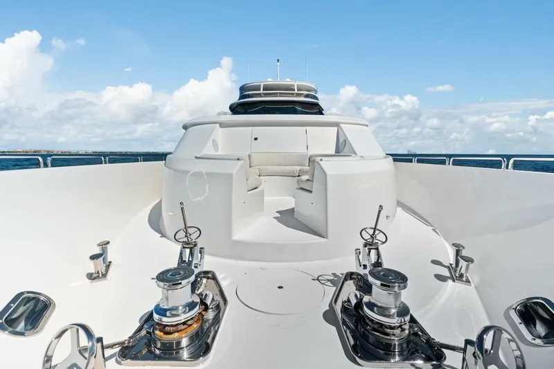 Yes Yacht Photos Pics Luxurious 2011 Westport yacht deck with seating, winches, and ocean view under blue sky.