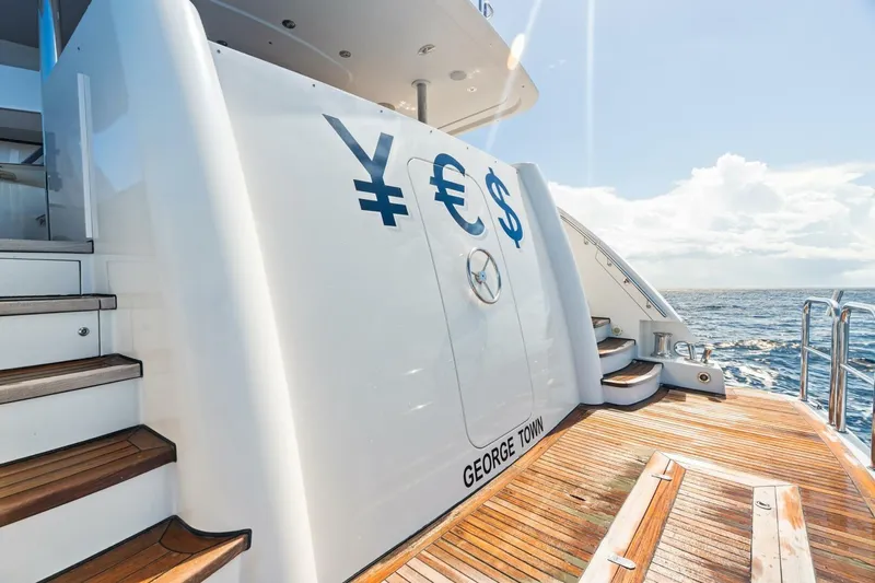 Yes Yacht Photos Pics Luxury Westport 2011 yacht deck with currency symbols, George Town registration, ocean view.