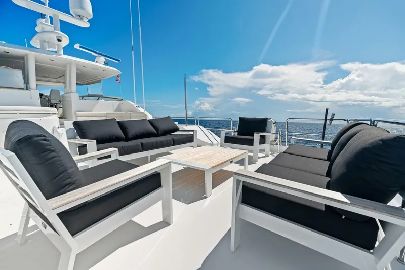 Yes Yacht Photos Pics Luxurious 2011 Westport yacht deck with elegant seating, ocean view, and clear blue sky.