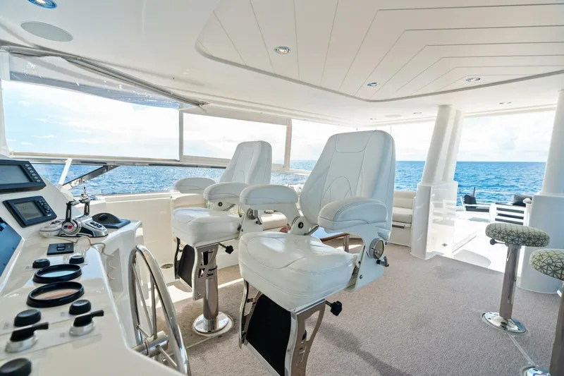 Yes Yacht Photos Pics Luxurious 2011 Westport yacht helm with white captain chairs and ocean view.