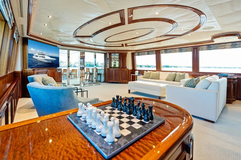 Yes Yacht Photos Pics Luxurious 2011 Westport yacht interior with elegant seating, chess set, and panoramic windows.