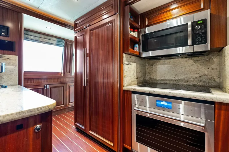 Yes Yacht Photos Pics Luxurious 2011 Westport yacht kitchen with wood cabinetry, modern appliances, and granite countertops.