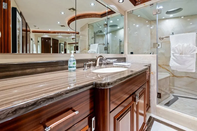 Yes Yacht Photos Pics Luxurious 2011 Westport yacht bathroom with elegant wood cabinetry and marble countertops.