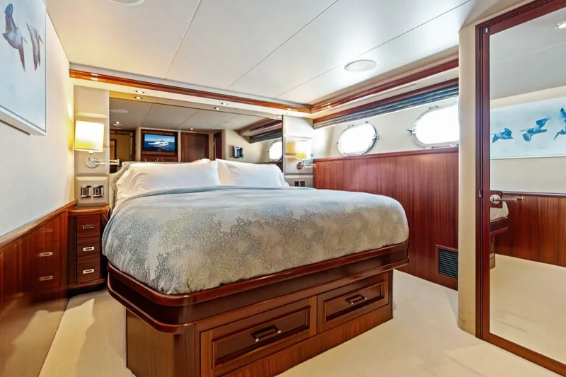 Yes Yacht Photos Pics Luxurious bedroom interior of a 2011 Westport yacht with elegant wood finishes.