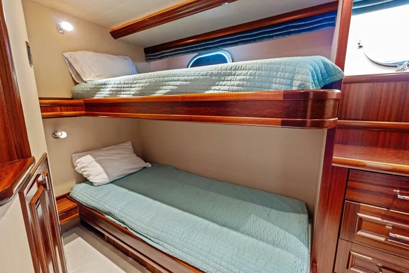Yes Yacht Photos Pics Luxurious 2011 Westport yacht cabin with wooden bunk beds and elegant furnishings.