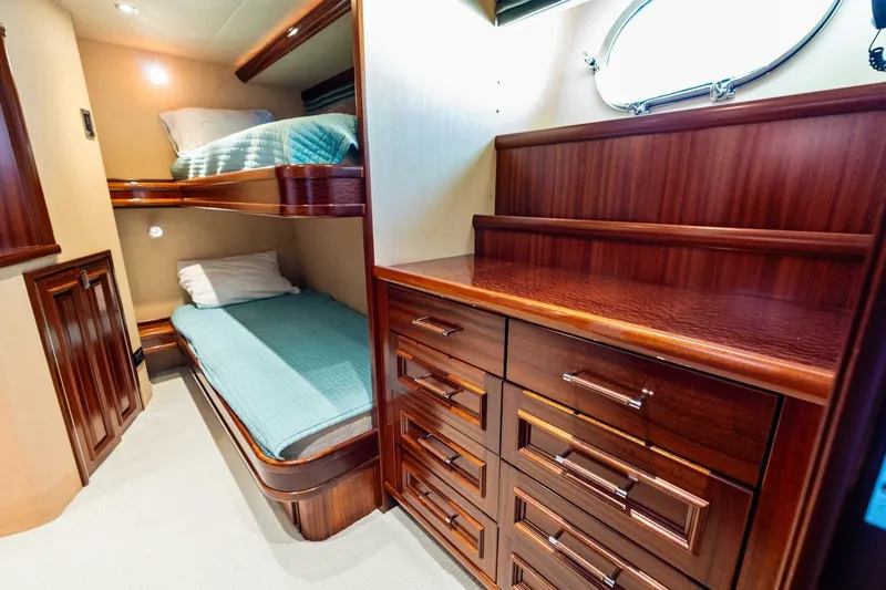 Yes Yacht Photos Pics Luxurious 2011 Westport yacht cabin with wooden bunk beds and storage drawers.