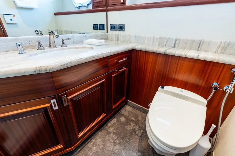 Yes Yacht Photos Pics Luxurious 2011 Westport yacht bathroom with marble countertop and elegant wood cabinetry.